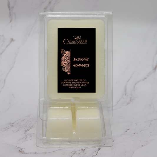 Blissful Romance Wax Melts offer a beautiful scent of campfire smoke, antique leather, clove leaf, and patchouli, making it the perfect choice for any room