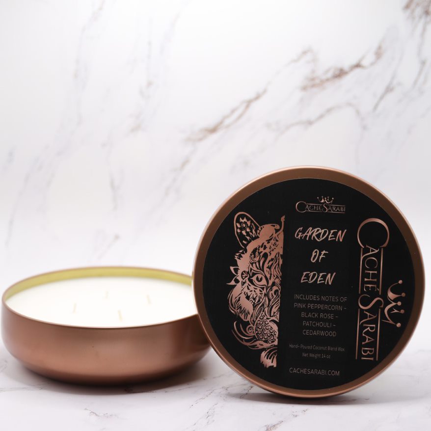 Our Garden of Eden four wick rose gold tin candle is created for you to be able to explore a lush paradise! With an indulgent blend of Pink Peppercorn, Black Rose, Patchouli, Grapefruit, and Cedarwood